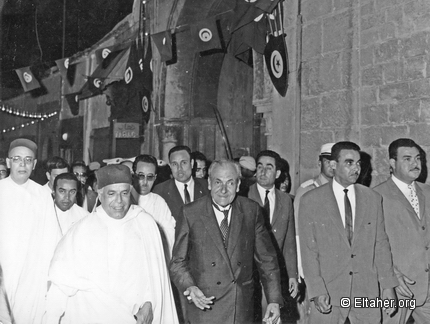 1966 - Bourguiba and Eltaher walking down Kasbah Street (Hassans head seen at the back)